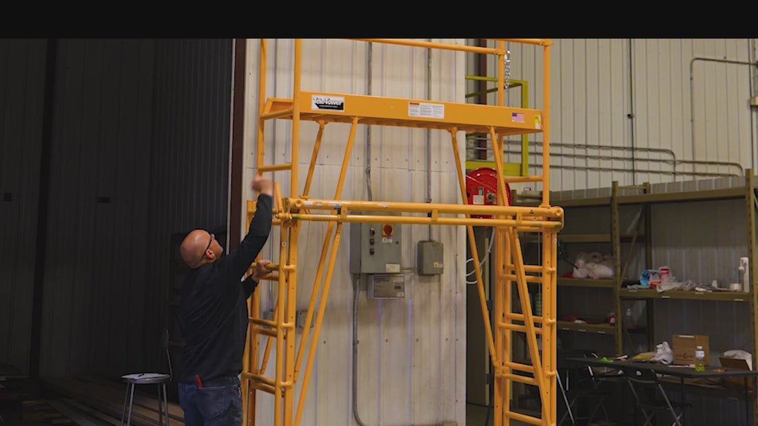Person raising and lowering Tele-tower